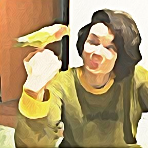 Blurred portrait of Claire Froelich with a bird sitting on hand